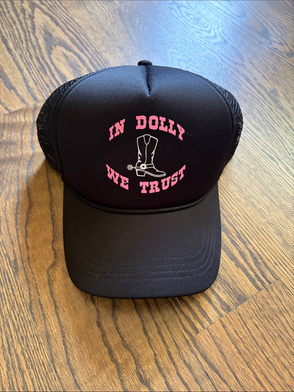 Black Trucker Hat with "In Dolly We Trust" Graphic